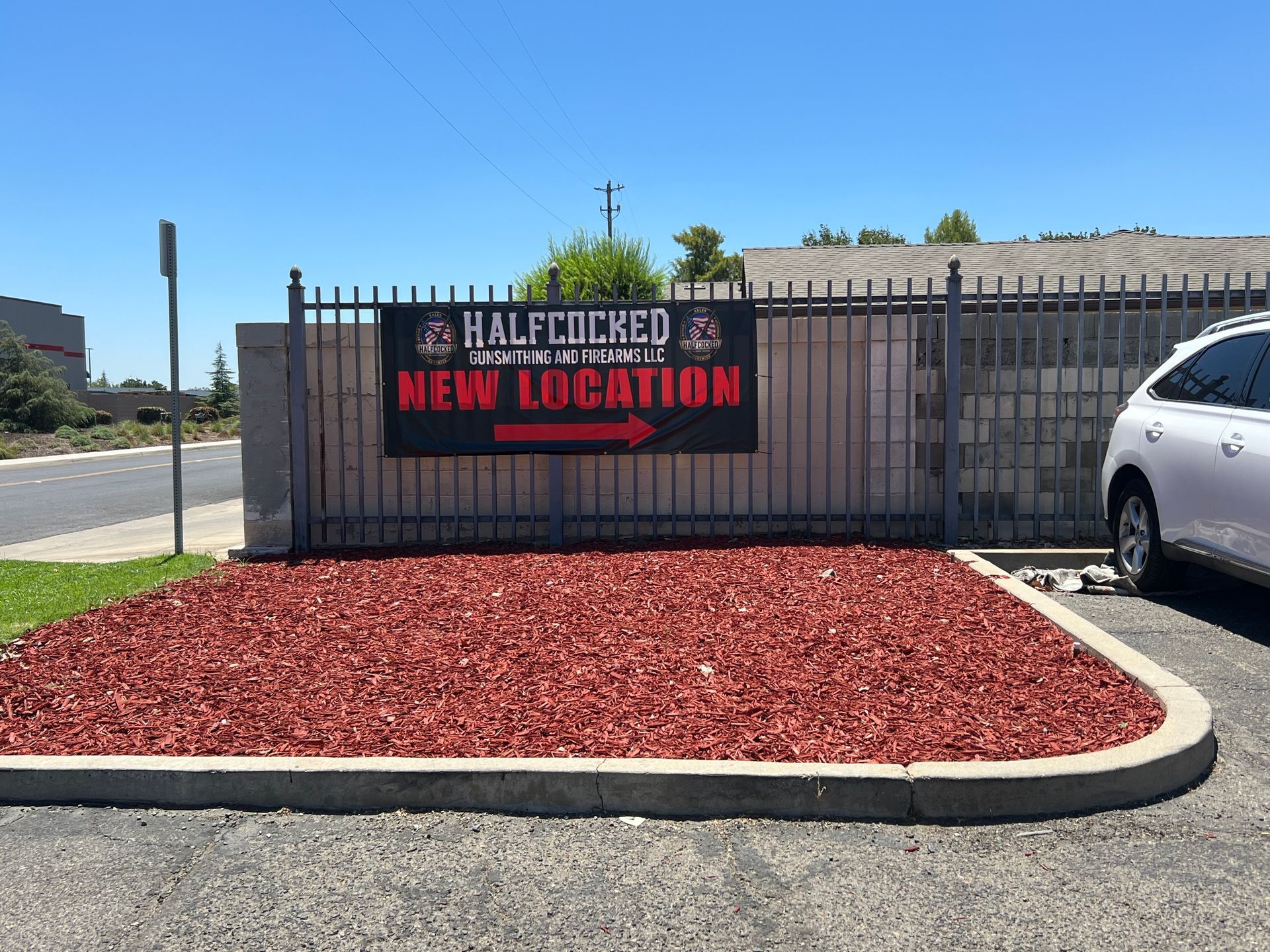 Storefront windows with Halftime Bar and Grille signs and an American flag graphic