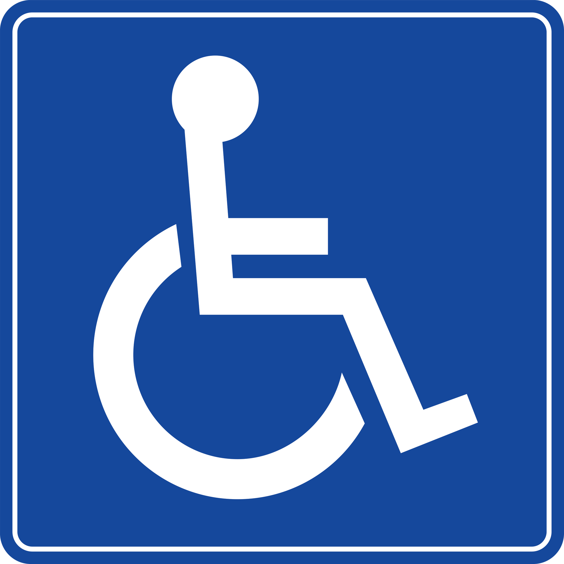 Blue wheelchair accessibility sign with a white wheelchair symbol