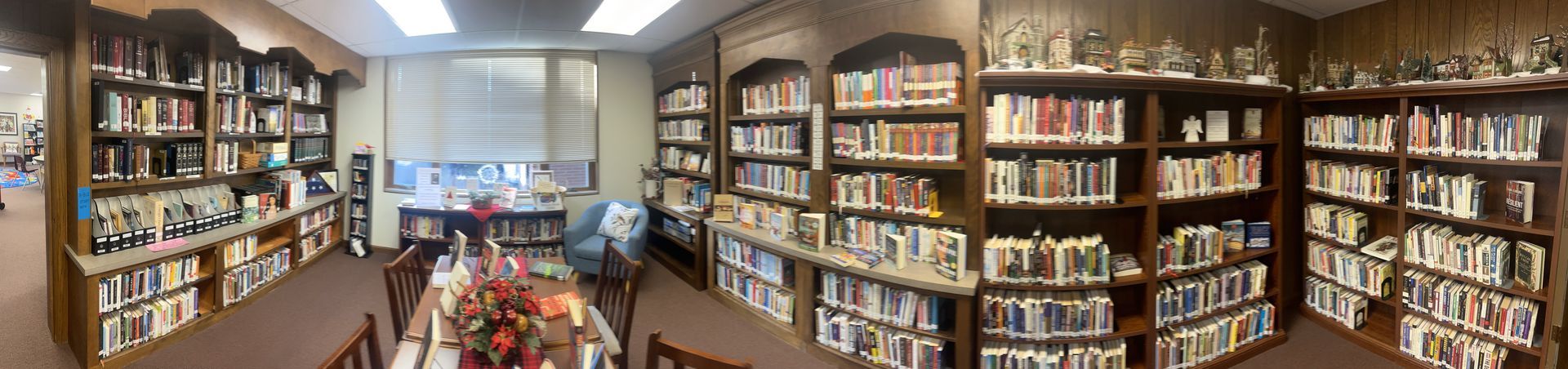 A panoramic view of a library filled with lots of books.