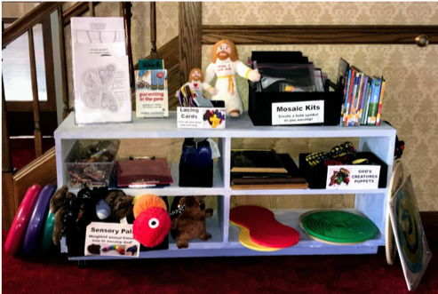 A shelf full of toys and books including a box that says mosaic kits