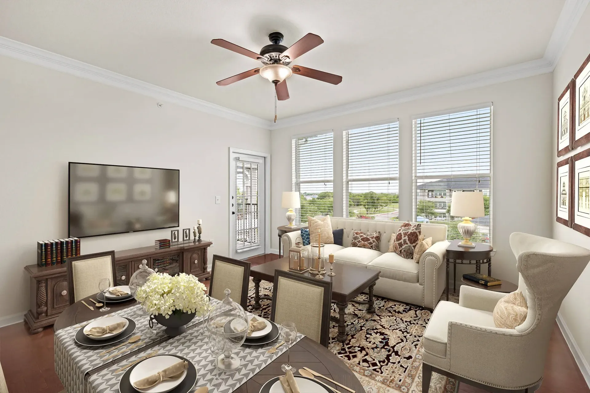 Living room and dining area with elegant furnishings and large windows.
