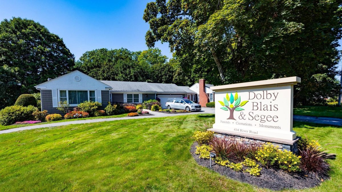 A one-story building with a sign that reads