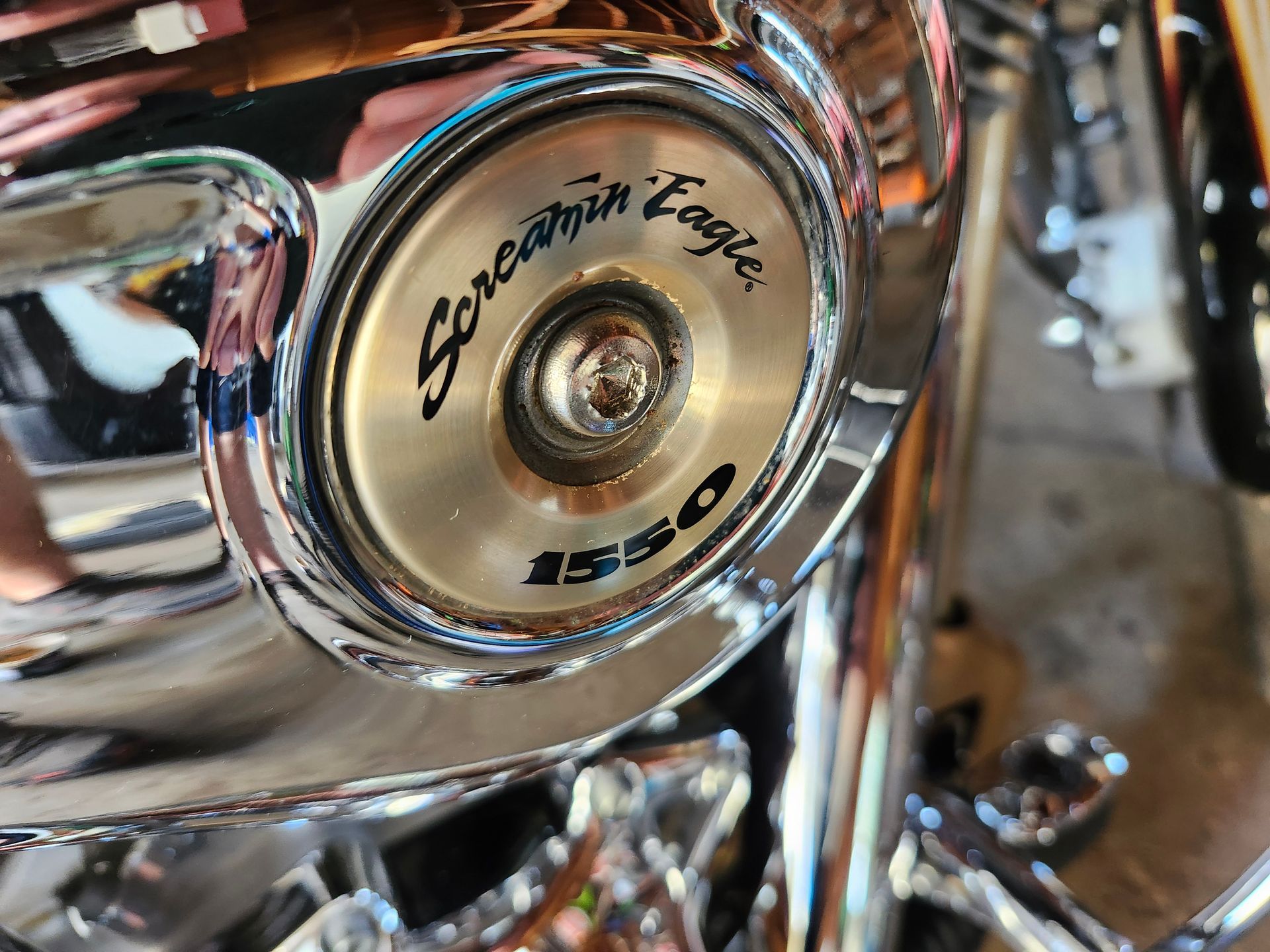 A close up of a harley davidson screamin eagle motorcycle
