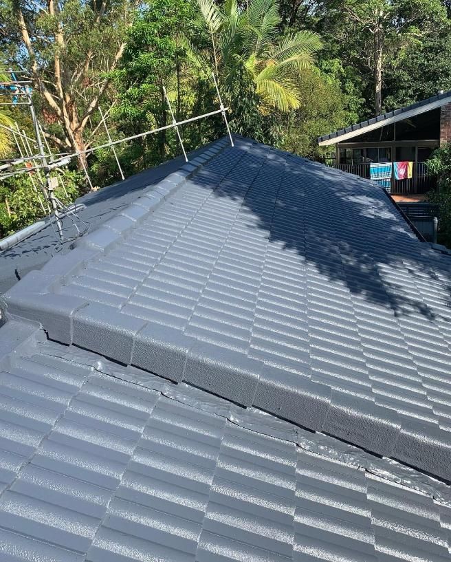 A Roof With a Lot of Tiles on It is Surrounded by Trees — Holster Painting Contractors In Port Macquarie, NSW
