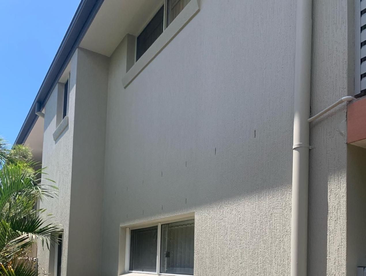 A White House With a Blue Sky in the Background — Holster Painting Contractors In Bonny Hills, NSW 