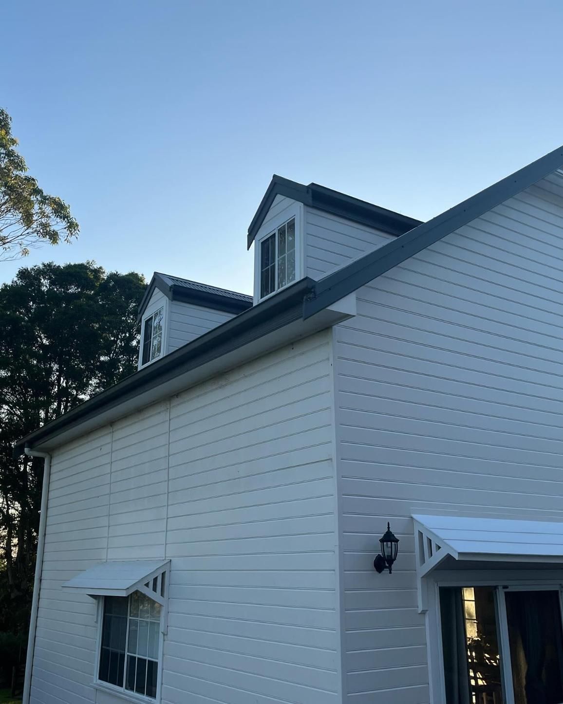 A White House With a Blue Sky in the Background — Holster Painting Contractors In Port Macquarie, NSW