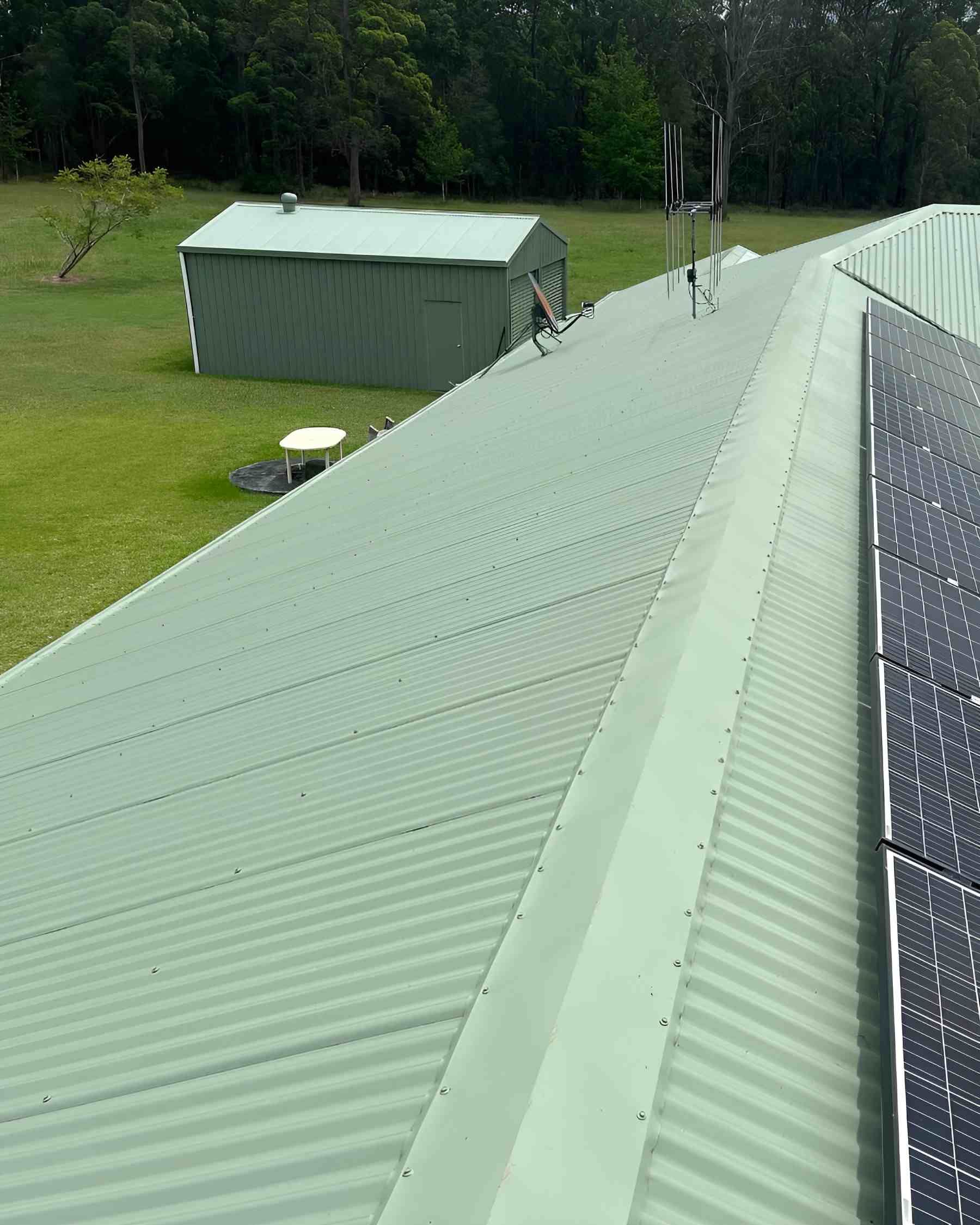 A Green Roof With a Lot of Solar Panels on It — Holster Painting Contractors In Port Macquarie, NSW