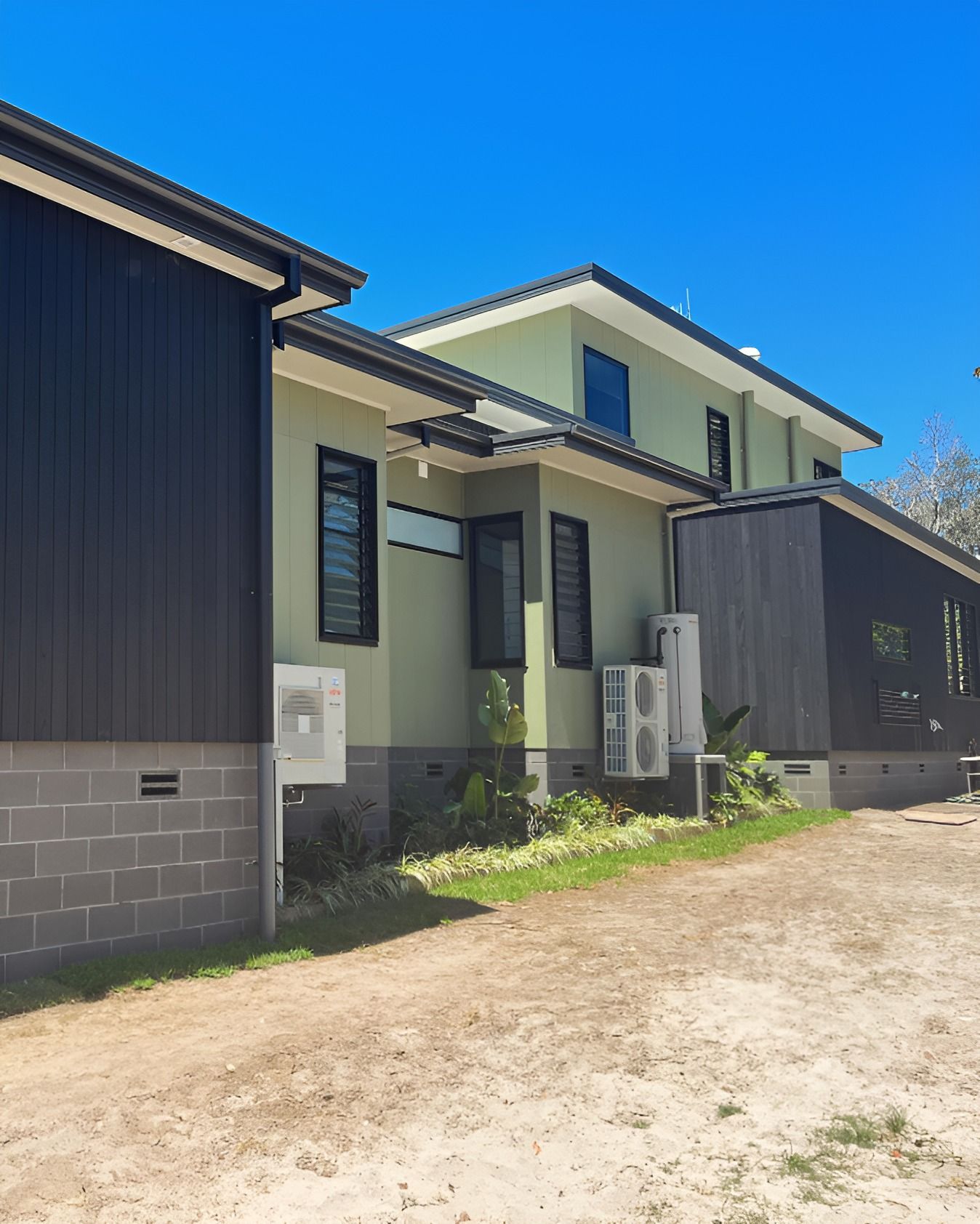 A White House With Stairs Leading Up to the Second Floor — Holster Painting Contractors In Port Macquarie, NSW 