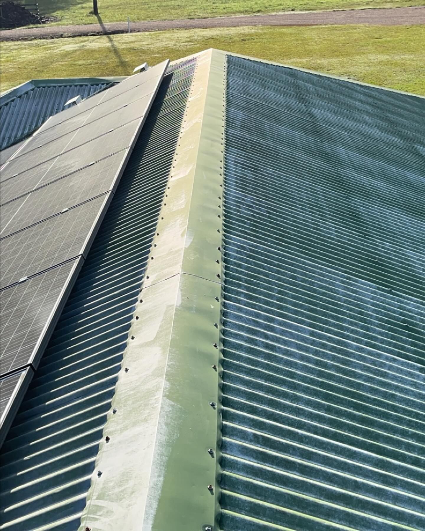 A Close Up of a Roof With a Green Stripe on It — Holster Painting Contractors In Port Macquarie, NSW