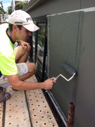 A Large White House With a Screened in Porch on a Sunny Day — Holster Painting Contractors In Port Macquarie, NSW