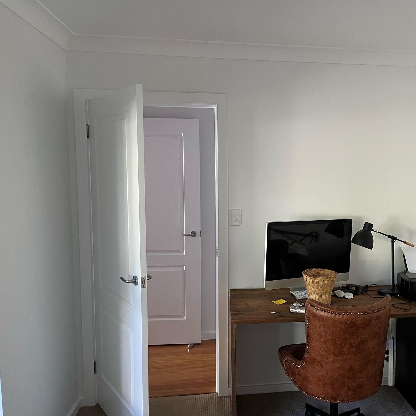 A Room With a Desk and Chair With a Computer on It — Holster Painting Contractors In North Haven, NSW