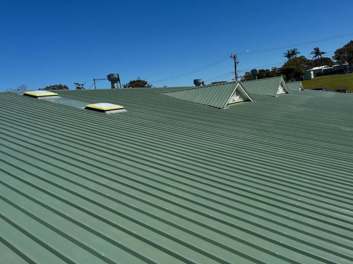 A Green Roof With a Blue Sky in the Background — Holster Painting Contractors In Port Macquarie, NSW