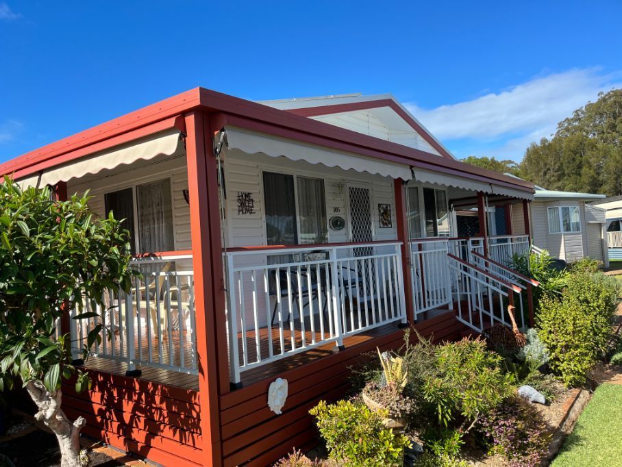 A House With a Red Porch and a White Railing — Holster Painting Contractors In Port Macquarie, NSW