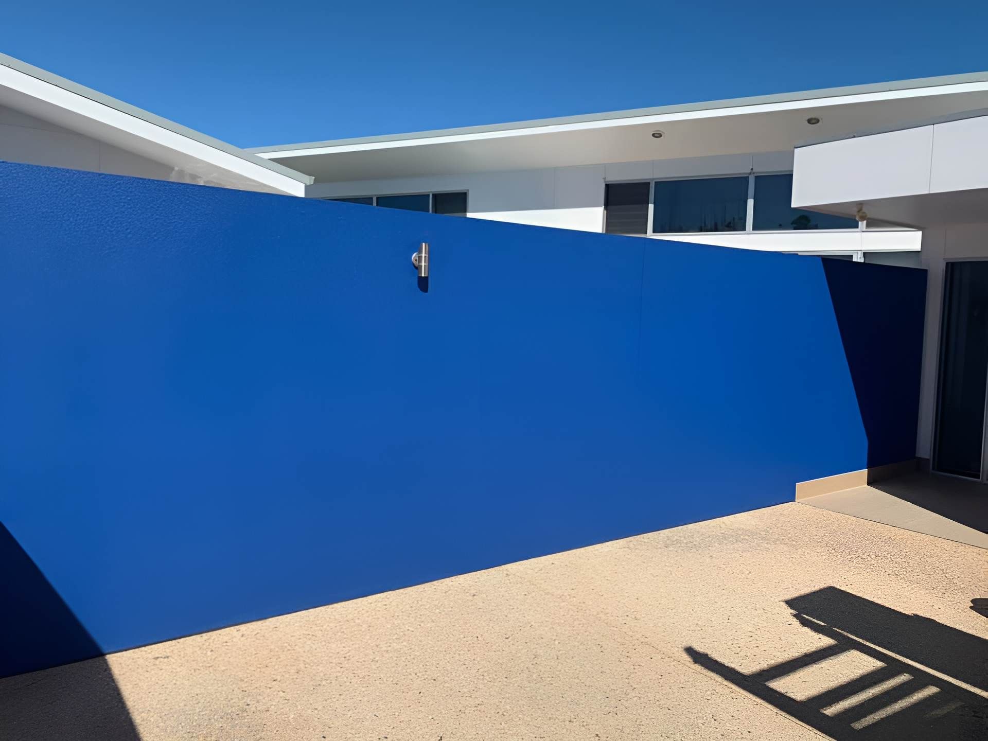 A White Car is Parked in Front of a Brick House — Holster Painting Contractors In Port Macquarie, NSW