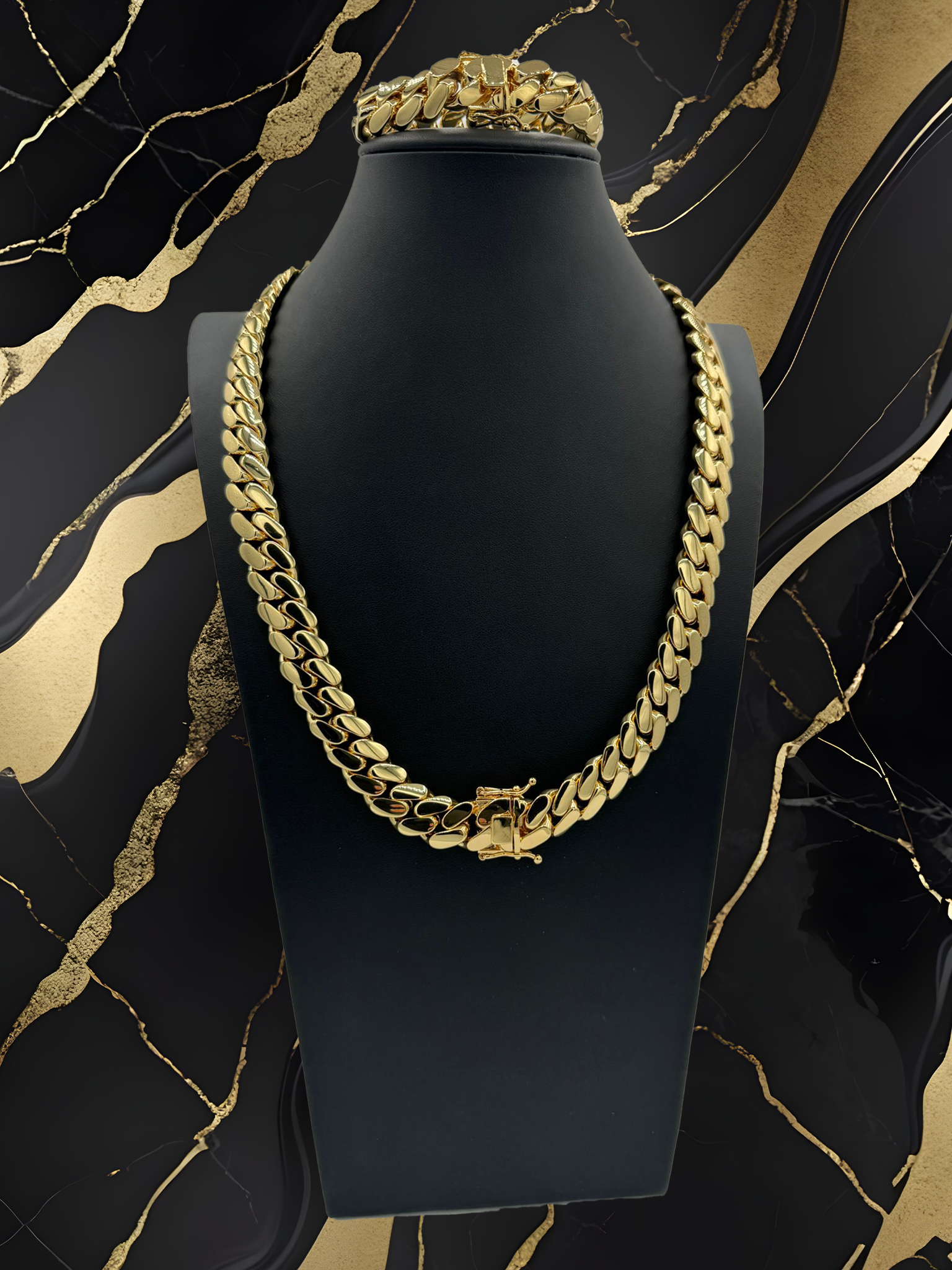 A gold chain and bracelet are on a mannequin.