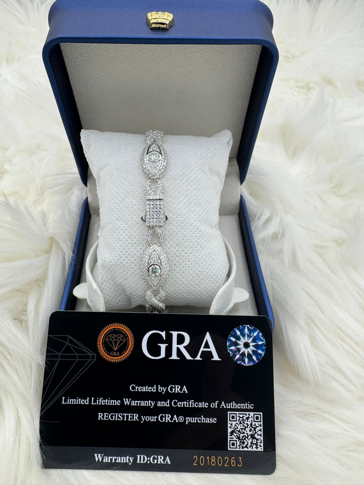 A bracelet in a blue box with a gra certificate