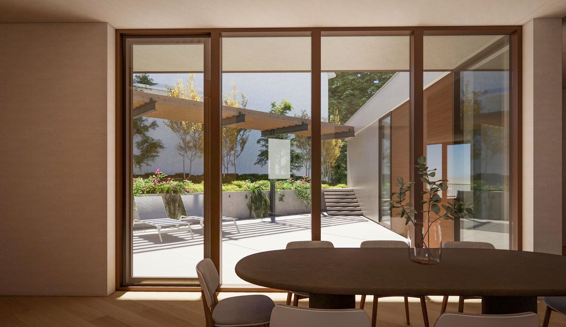 Dining room with floor-to-ceiling glass doors opening to the courtyard