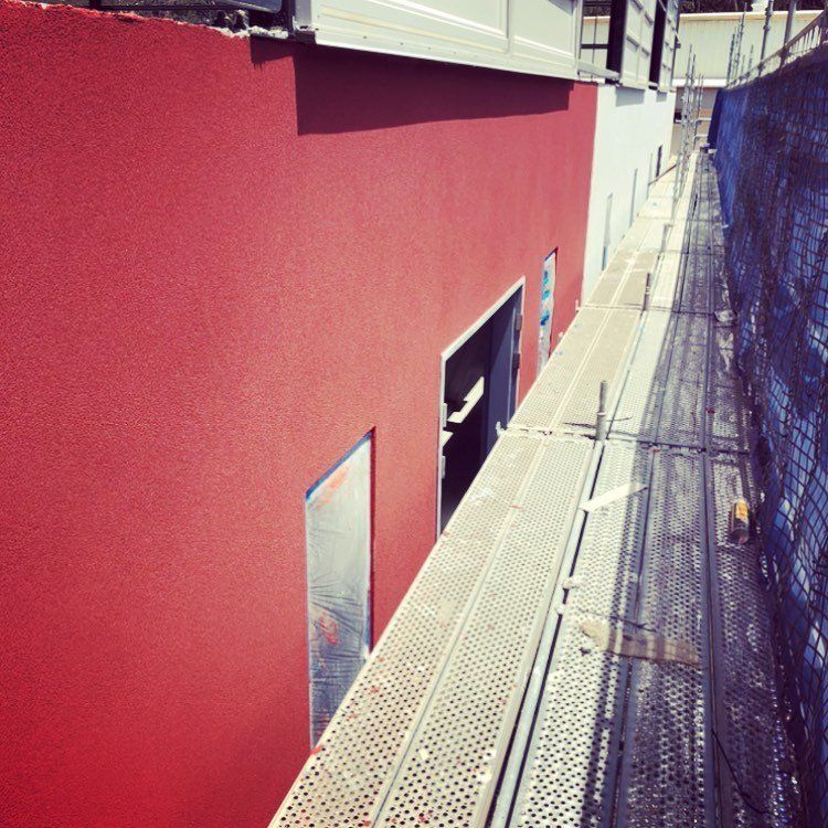 Lower windowed red wall — Pricing Guide in Brisbane, QLD