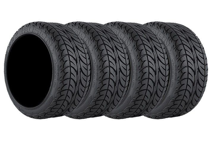 Four black tires are stacked on top of each other on a white background.