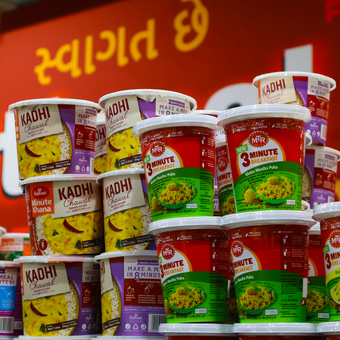 A bunch of cups of kashi are stacked on top of each other