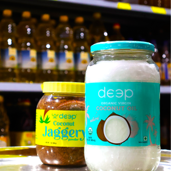 A jar of jaggery next to a jar of deep coconut oil