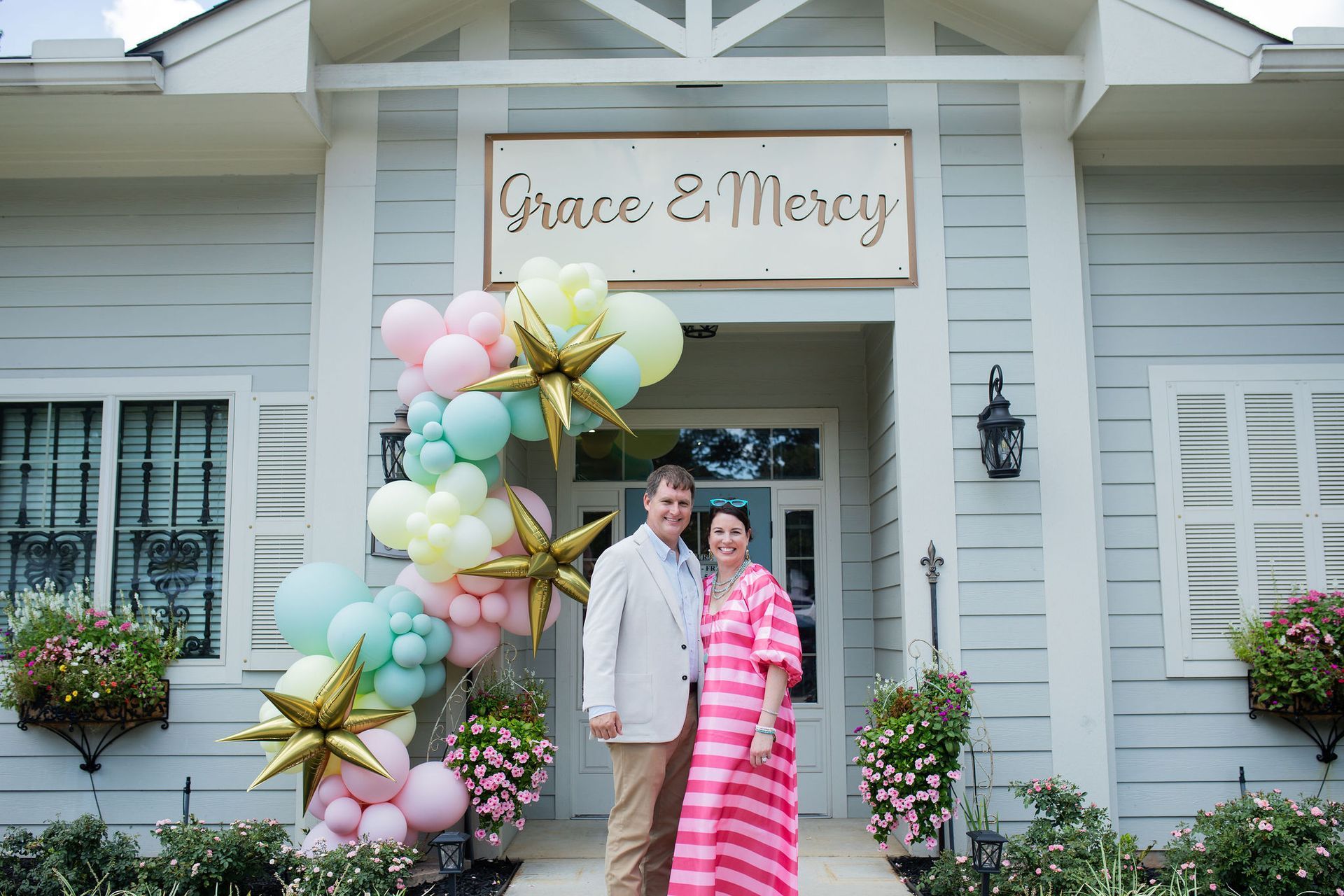 Couple stands in front of 