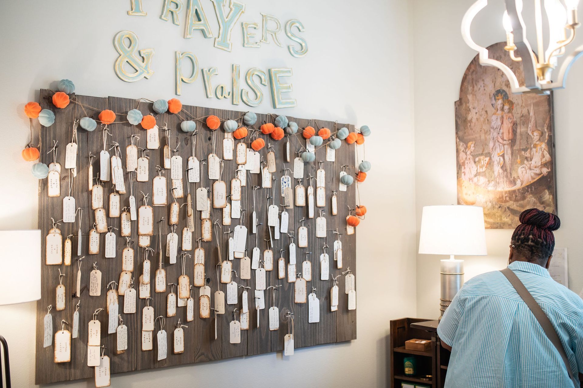 Wooden board with prayer tags; 