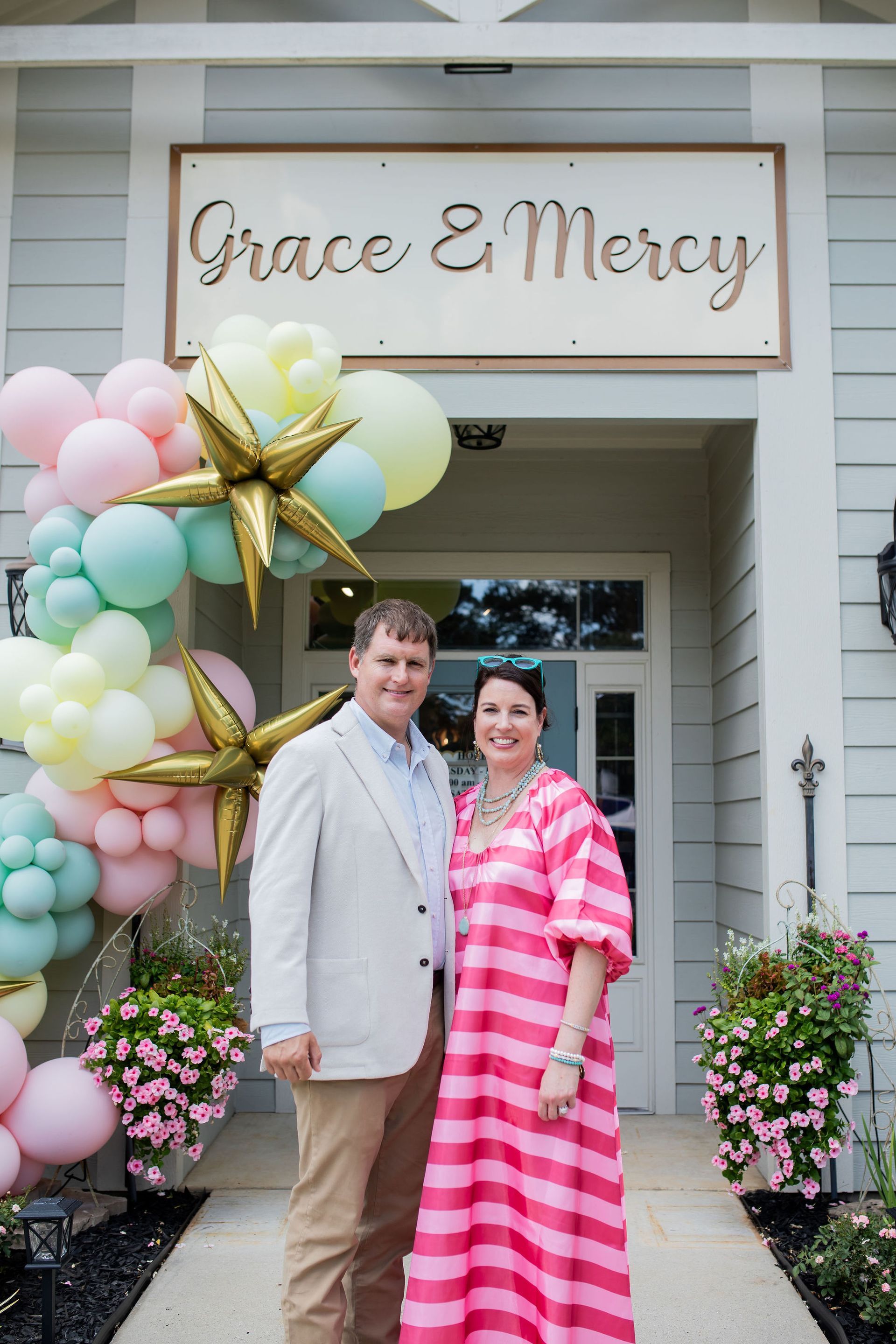 Couple stands in front of 
