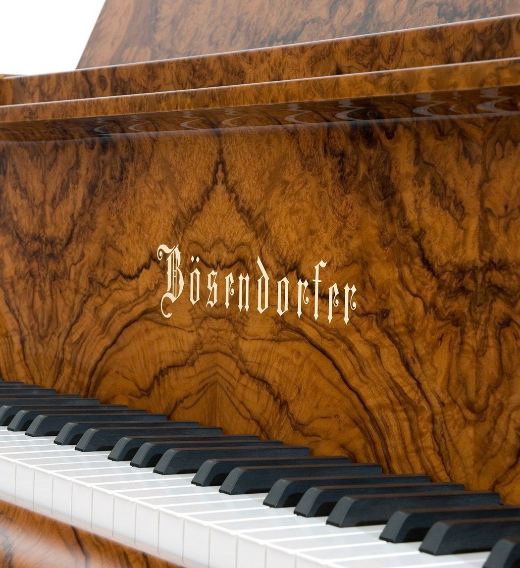 louisa behind a piano
