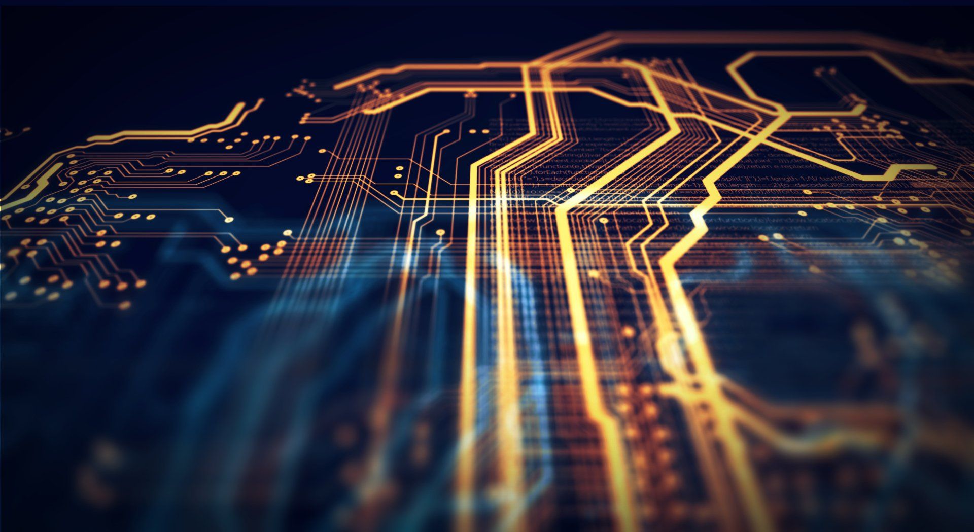 A close up of a circuit board on a dark background.