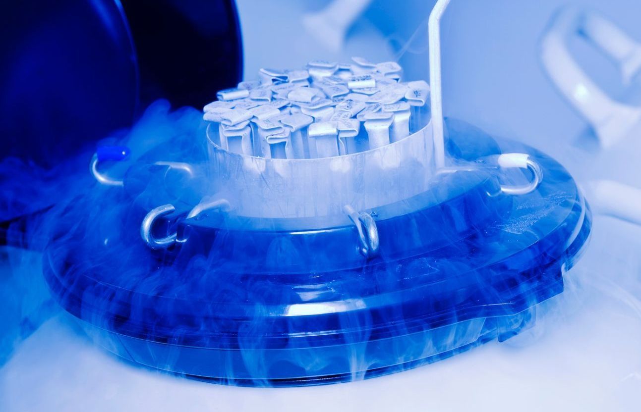 A container filled with liquid nitrogen is sitting on a table.