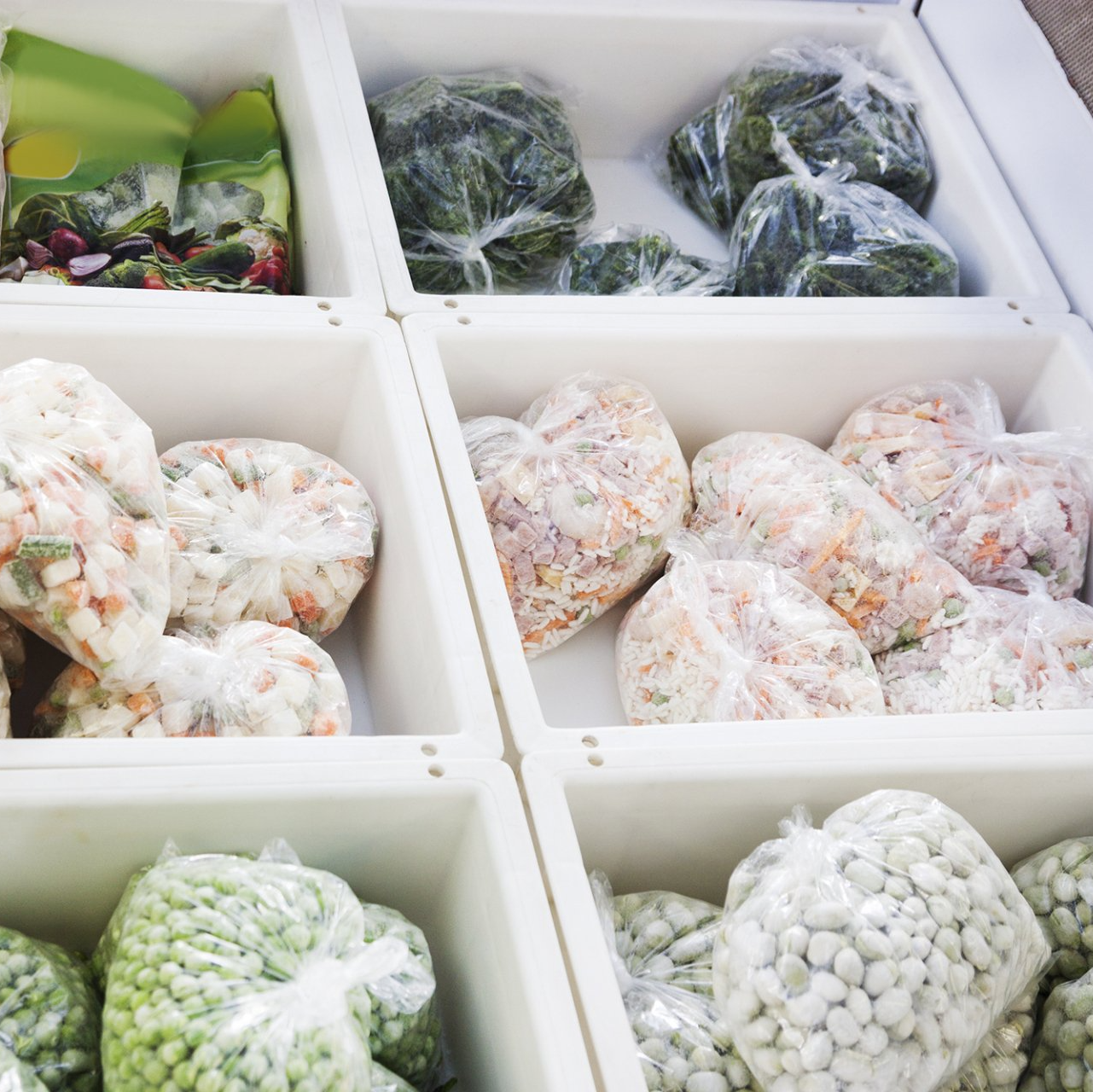 perishable food in storsge A variety of frozen vegetables including peas and spinach