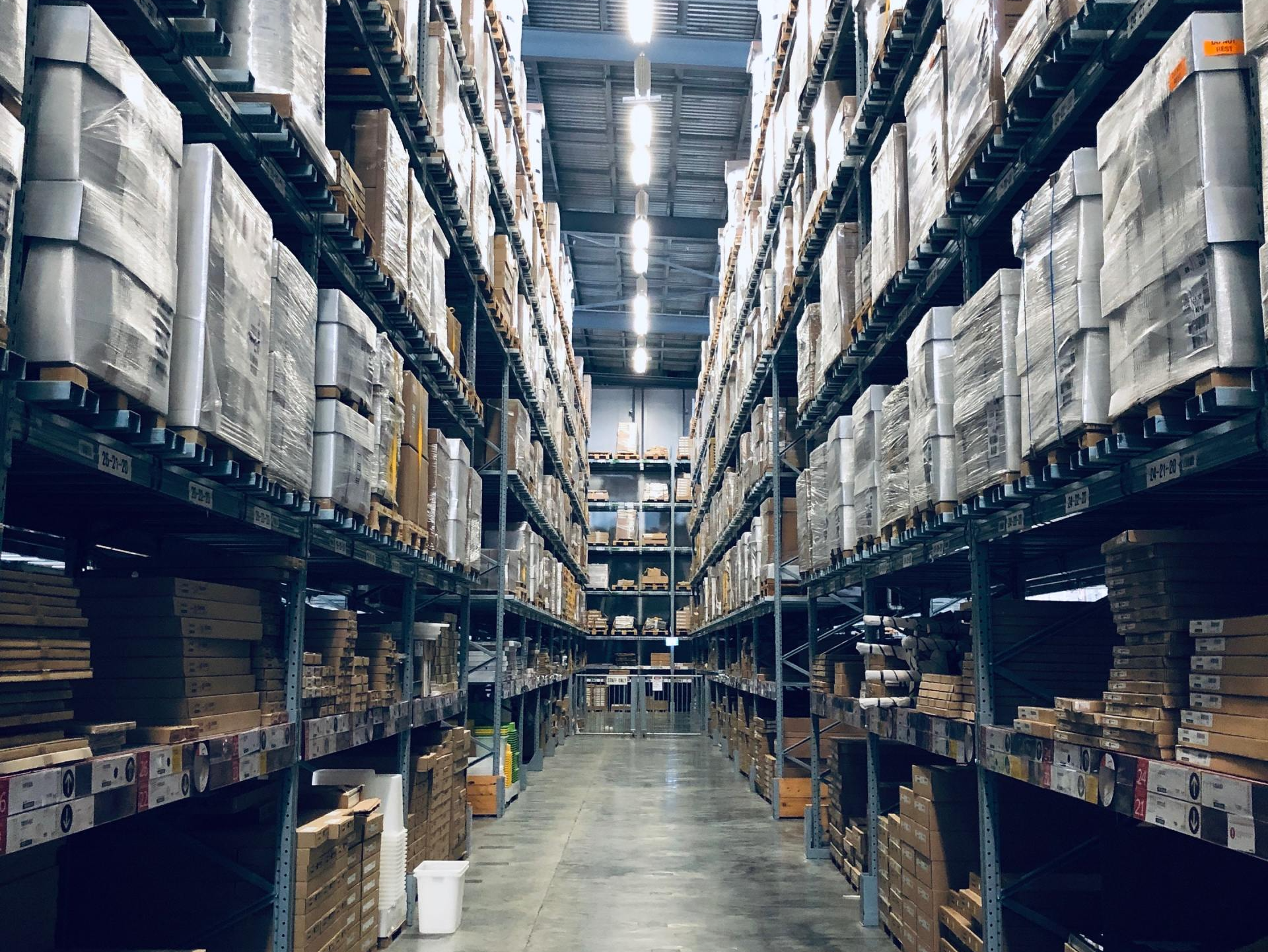OTIF stands A large warehouse filled with lots of boxes on shelves.