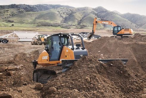 Heavy Equipment CASE heavy equipment working on a job site.