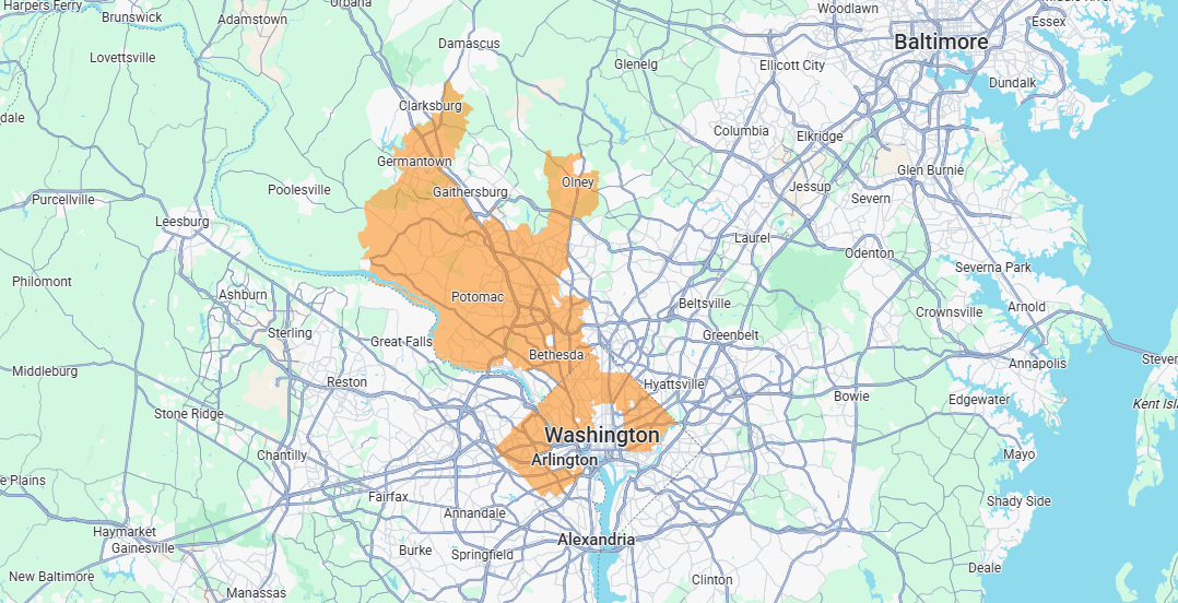 Map with orange highlighted route area spanning a city and surrounding roads near a blue shoreline