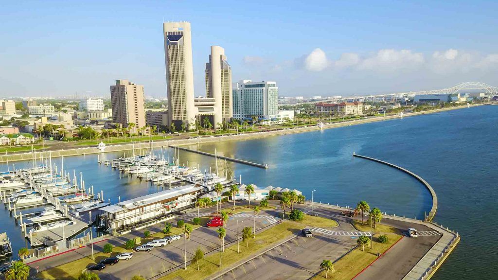 An aerial view of a city next to a body of water.