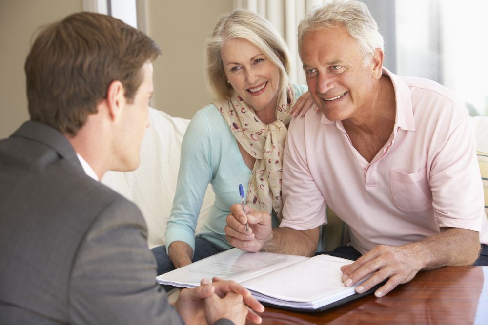 A Financial Advisor Consults with A Smiling — Freedom Wealth Solutions in Mornington, VIC