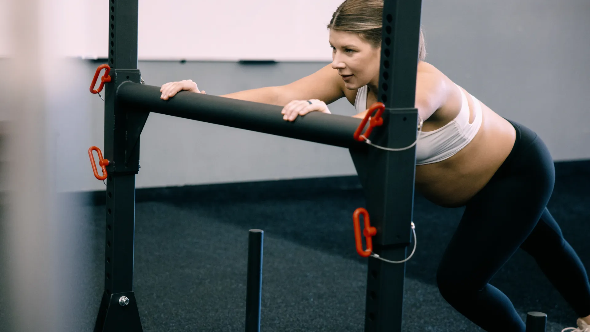 Pregnant woman performing supported strength training in Pleasant Hill