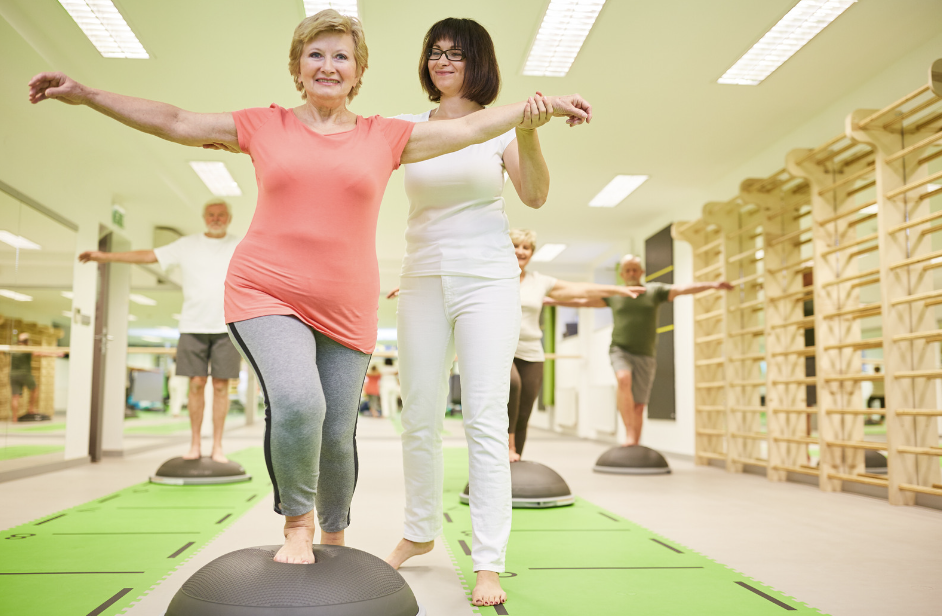 A person balancing on one leg on a Bosu ball, demonstrating balance training to improve stability and core strength.