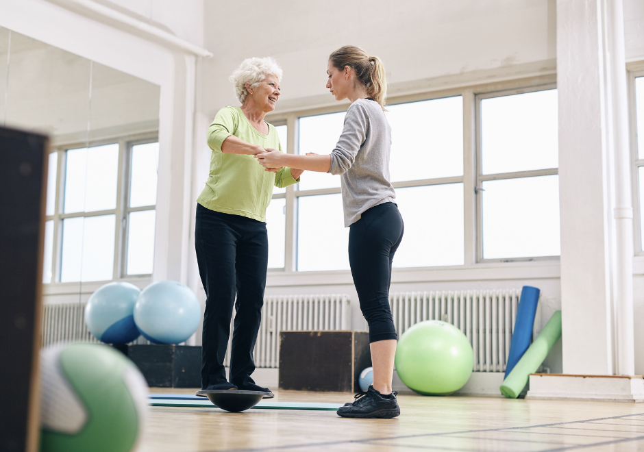 A person performing balance and stability training by demonstrating core strength and control during the exercise.