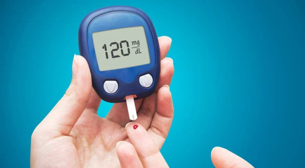 Blood glucose meter showing 120 mg/dL during diabetes monitoring