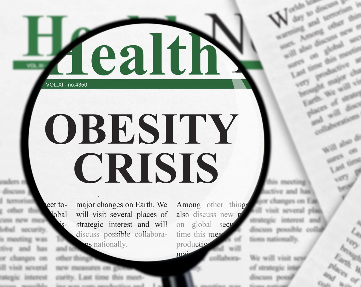 Obesity crisis newspaper headline under magnifying glass