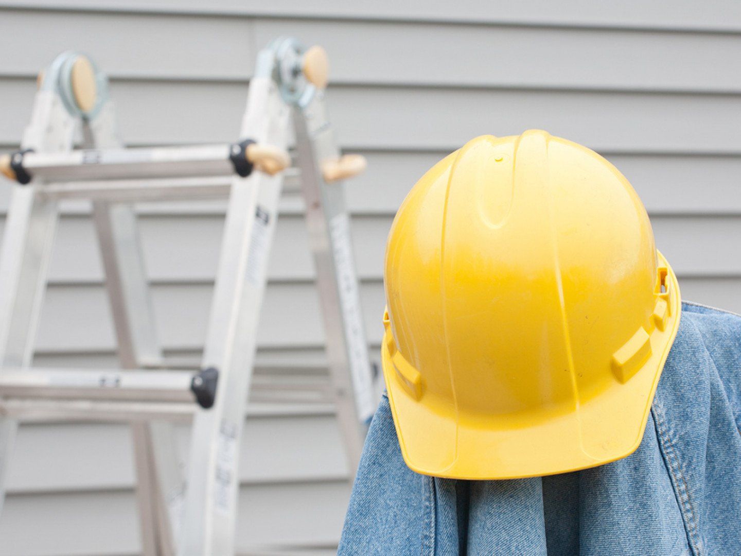 hardhat and denim shirt hanging