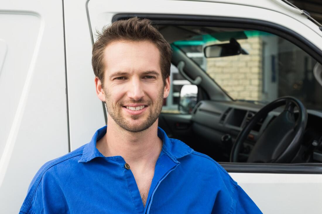 an air duct cleaniong technician standing in front of his van in tempe, az