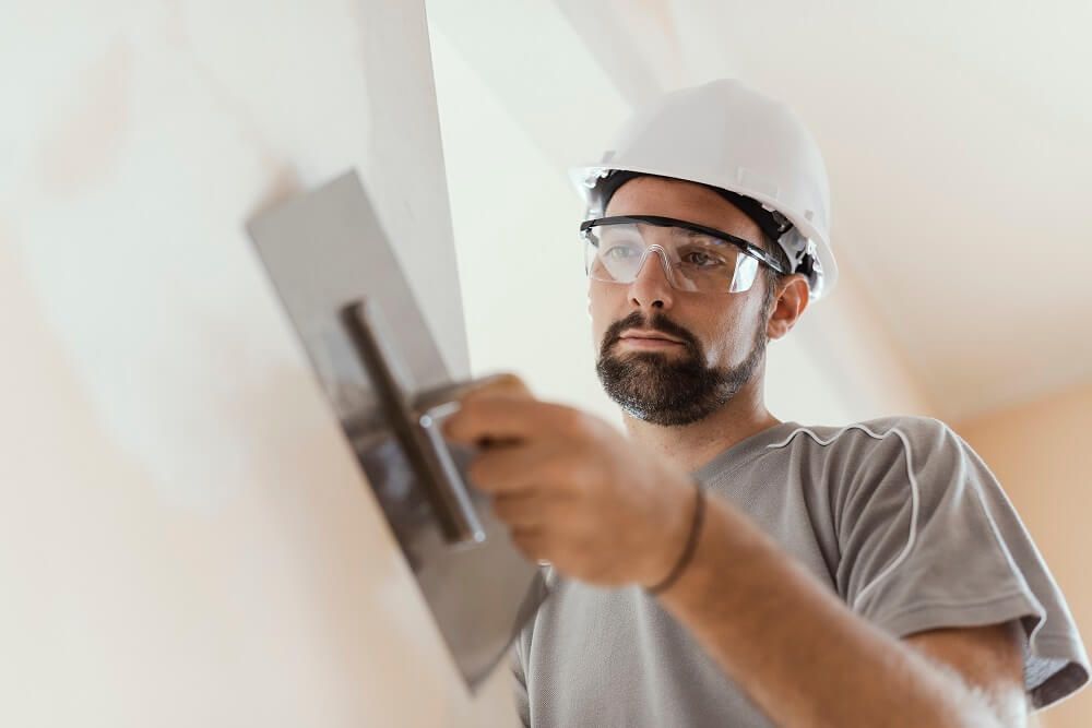 professional painter applying plaster
