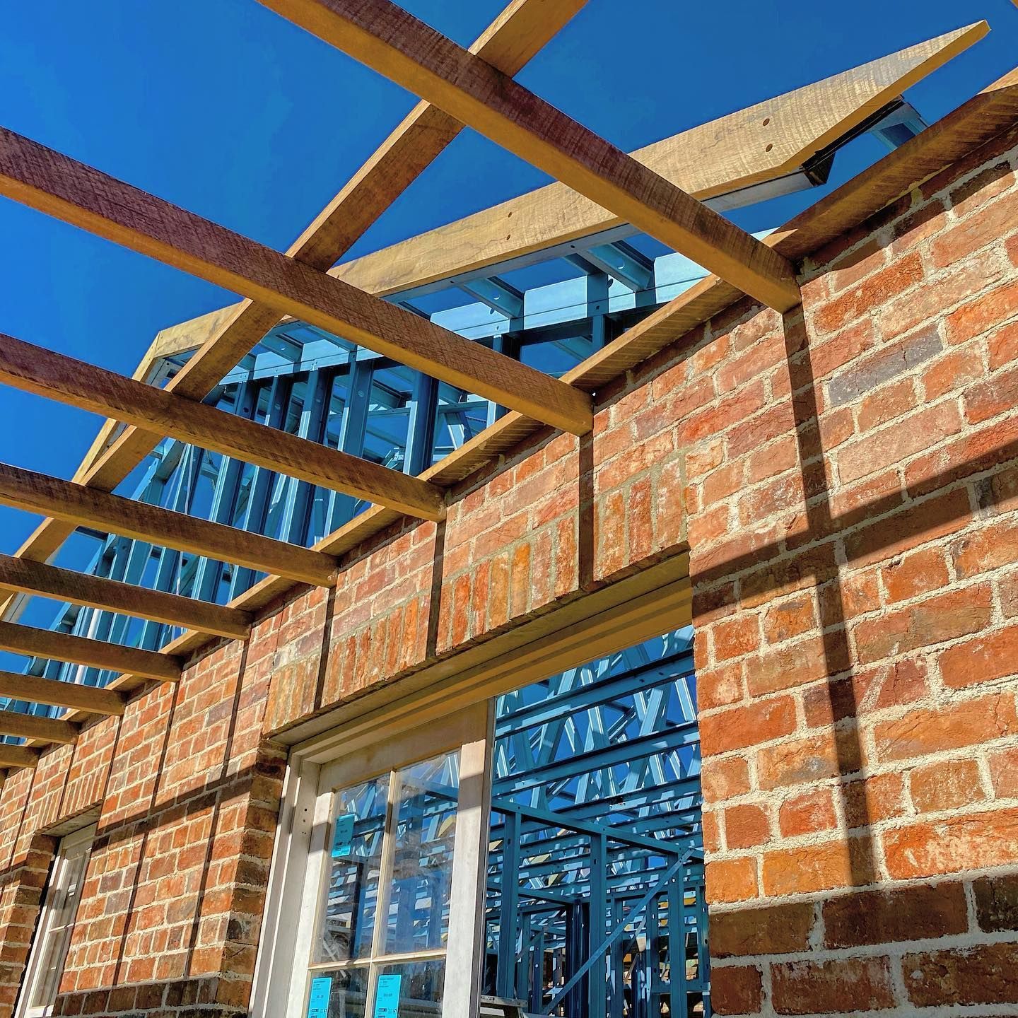 A Blue Metal Frame of a Building Under Construction — Steel Frame Company In Dubbo, NSW