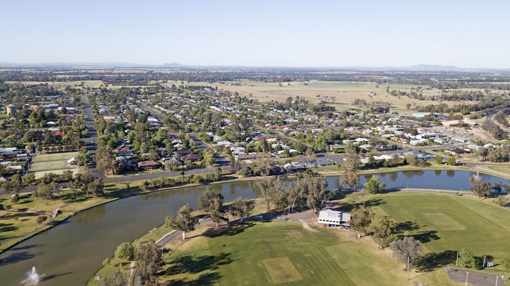 An Aerial View of a Residential Area With a Lake and a Golf Course — Steel Frame Company In Forbes, NSW