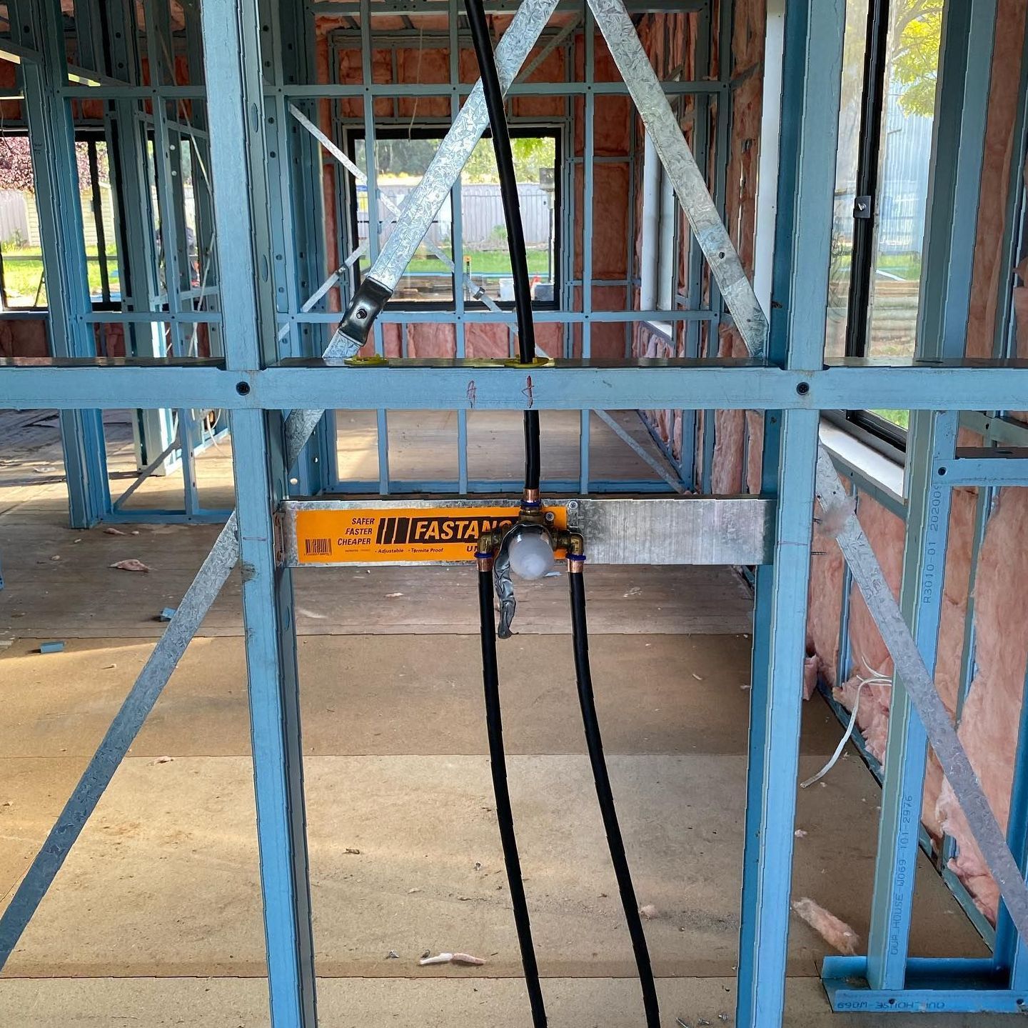 A Building Under Construction With a Yellow Sign — Steel Frame Company In Dubbo, NSW