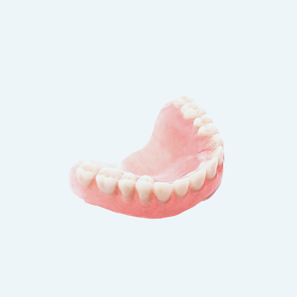 A set of dentures with pink gums and white teeth.