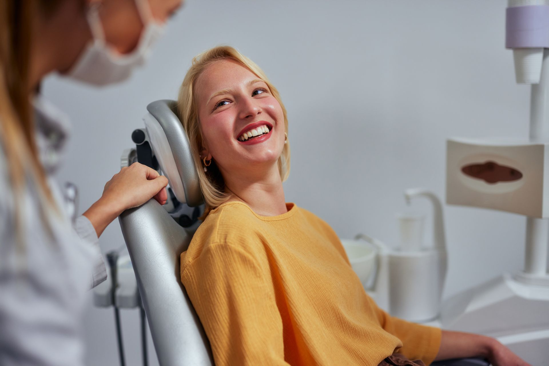 Woman with restored teeth | Find dental implants in Four Corners, FL.